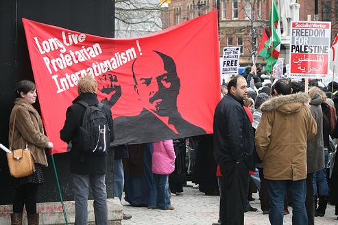 Communist Students raise the banner of Lenin