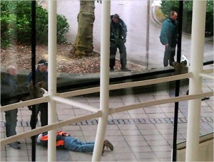 Armed police detain a student outside the library of John Moores University